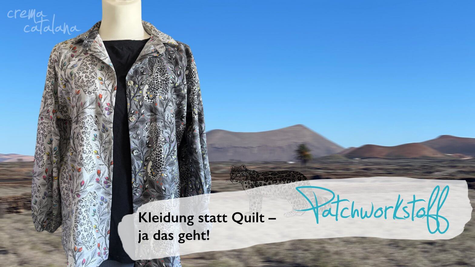 Alea-Bluse aus Tula Pink Graywork offen über schwarzem Top getragen, Vulkanlandschaft im Hintergrund, Text: Kleidung statt Quilt – ja das geht!